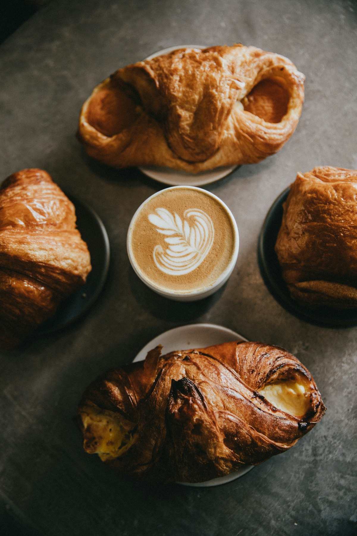 Warm coffee and fresh pastries on a table, because eating normally again was the whole point